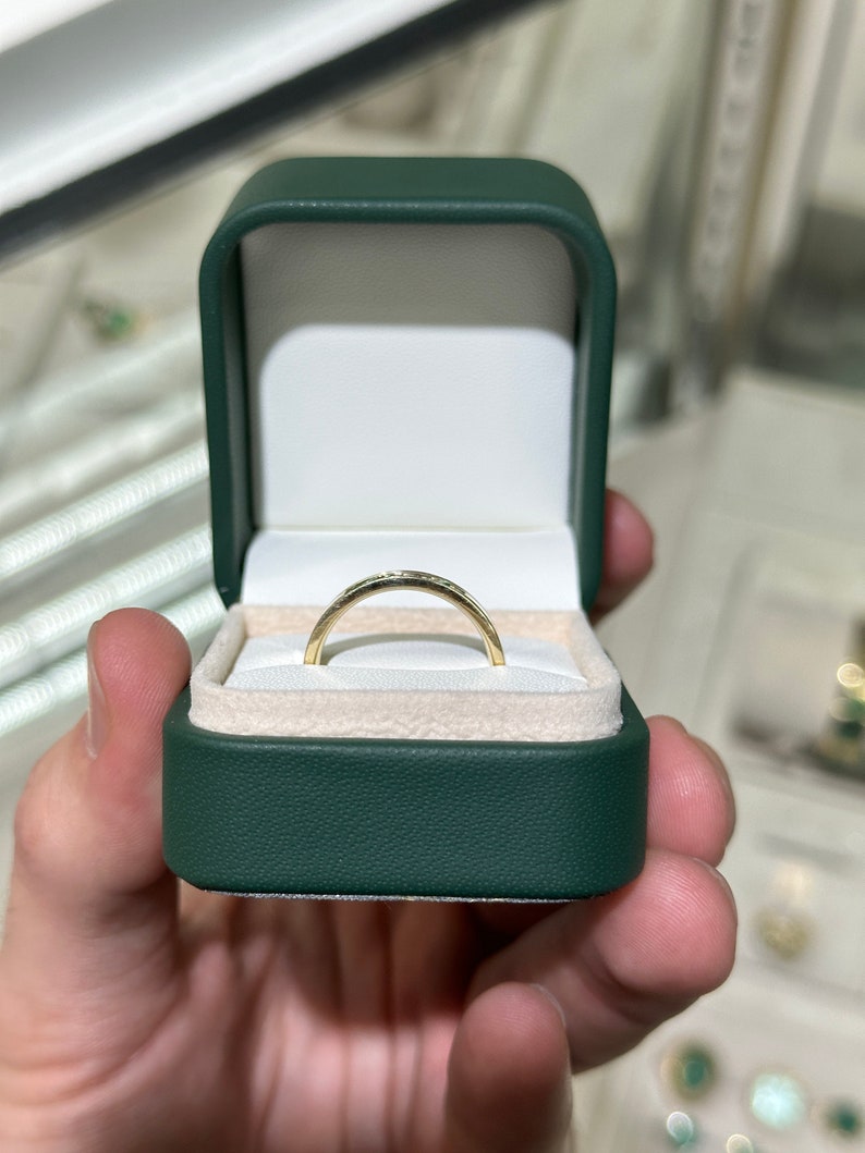 Medium green round cut emerald men's and unisex ring, 0.40tcw, set in 14K gold, from JR Colombian Emeralds.
