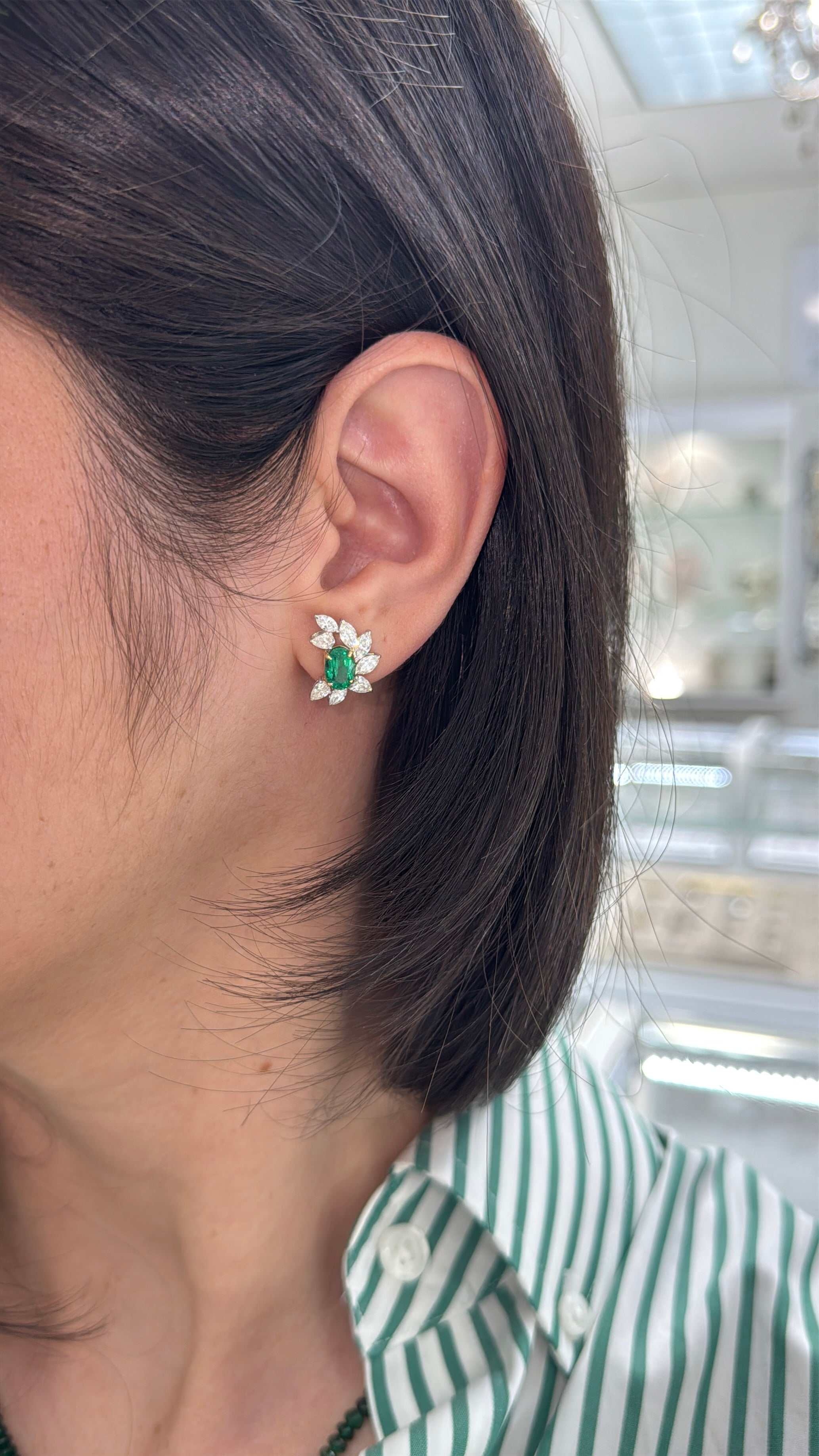 JR Colombian Emeralds oval emerald and diamond marquise and pear statement stud earrings in 18K gold, showcasing intricate gemstone designs.
