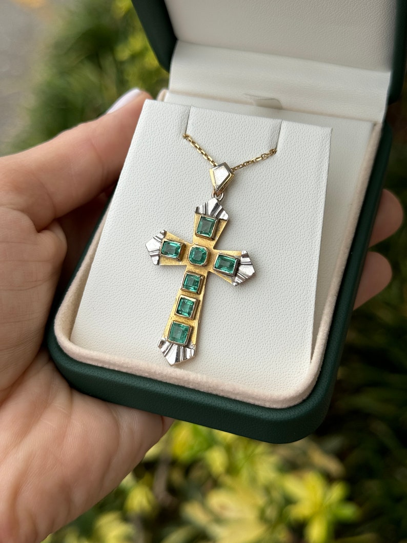 Unisex Colombian emerald cross pendant with 2.55ctw 18K two-tone yellow and white gold, showcasing vibrant green emeralds.