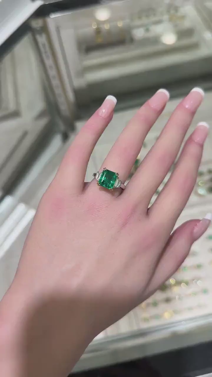 Stunning 18K Platinum Ring Featuring 4.85tcw Asscher Cut Emerald & Trapezoidal Diamonds