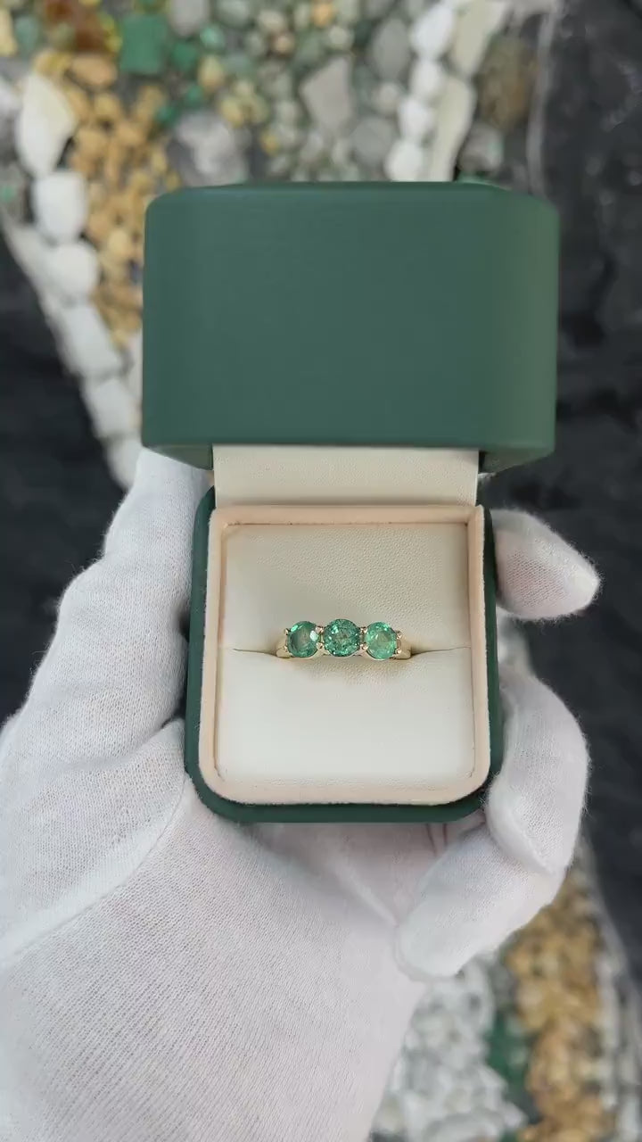 2.20 carat round emerald three-stone ring for women in 14K gold, featuring deep green gemstones