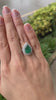 Stunning 8.70tcw Pear Shaped Emerald with Double Diamond Halo in 18K Gold Setting