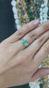 1.25tcw 18K White Gold Round Emerald & Tapered Baguette Diamond Accent 6 Prong Ladies Ring