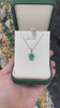 14K Oval Emerald Pendant with Round Diamond Accents and Lush Green Floral Detail