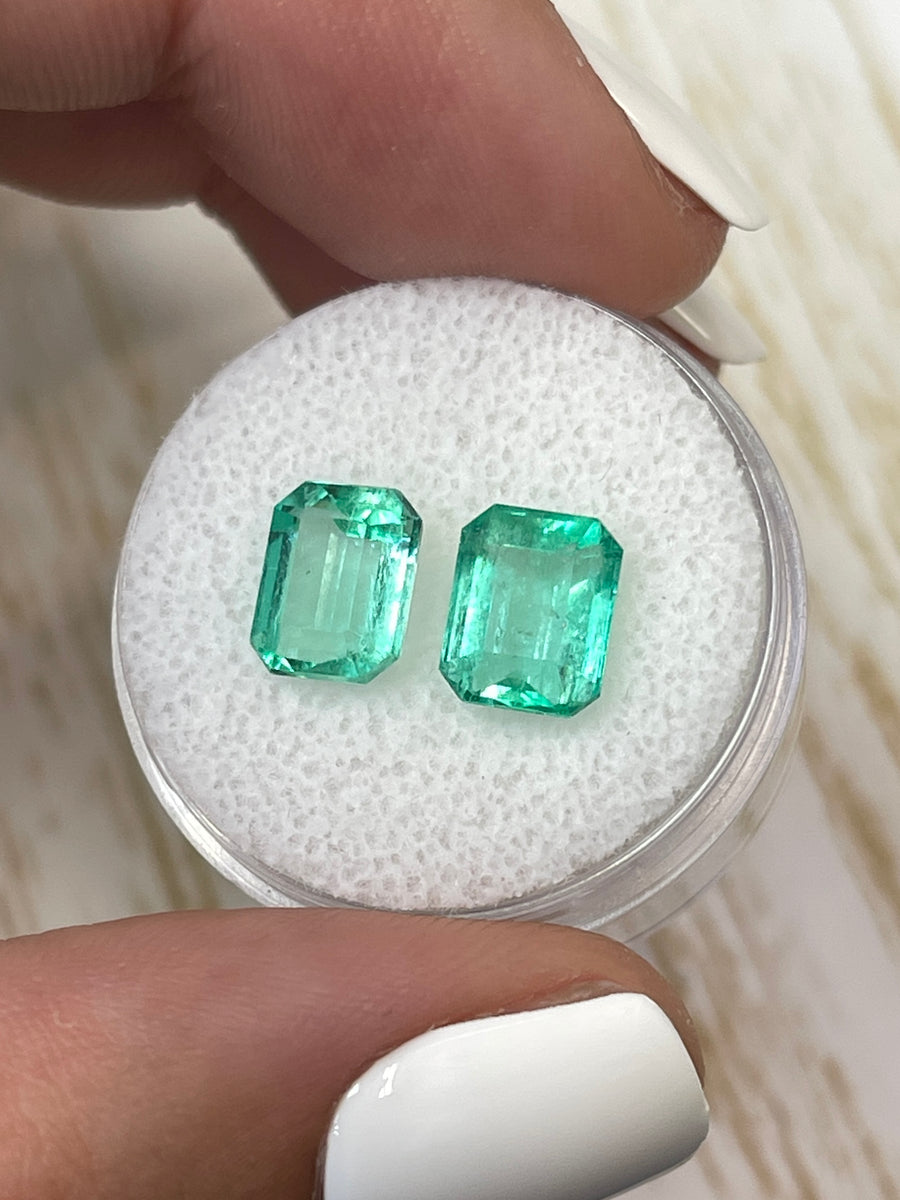 Two Matching Green Colombian Emeralds - 4.06tcw, Emerald Cut, 8.5x6.5 Dimensions