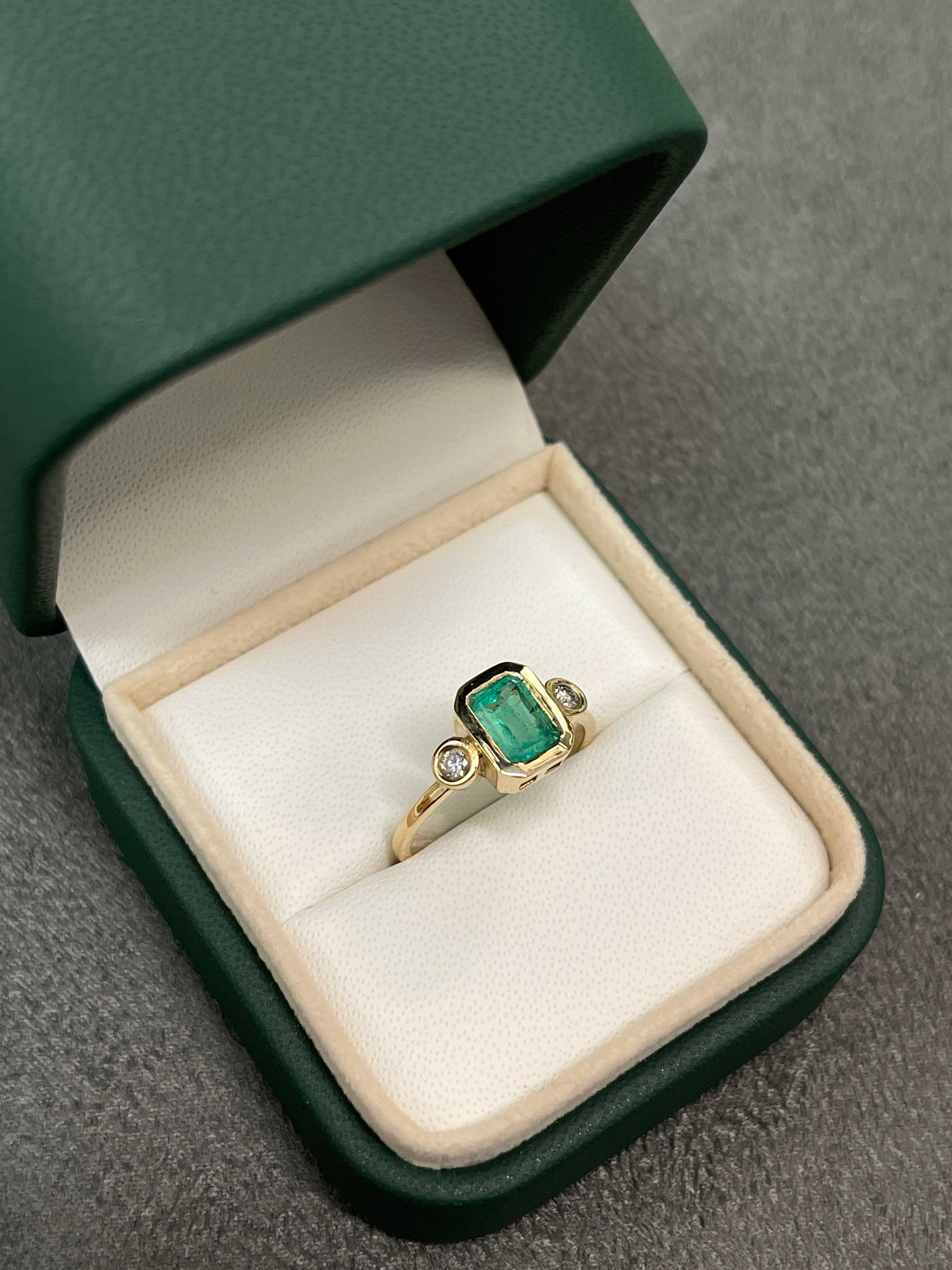 Radiant 14K Gold Ring with 1.20tcw Bezel Set Three Stone Emerald & Diamond Ensemble