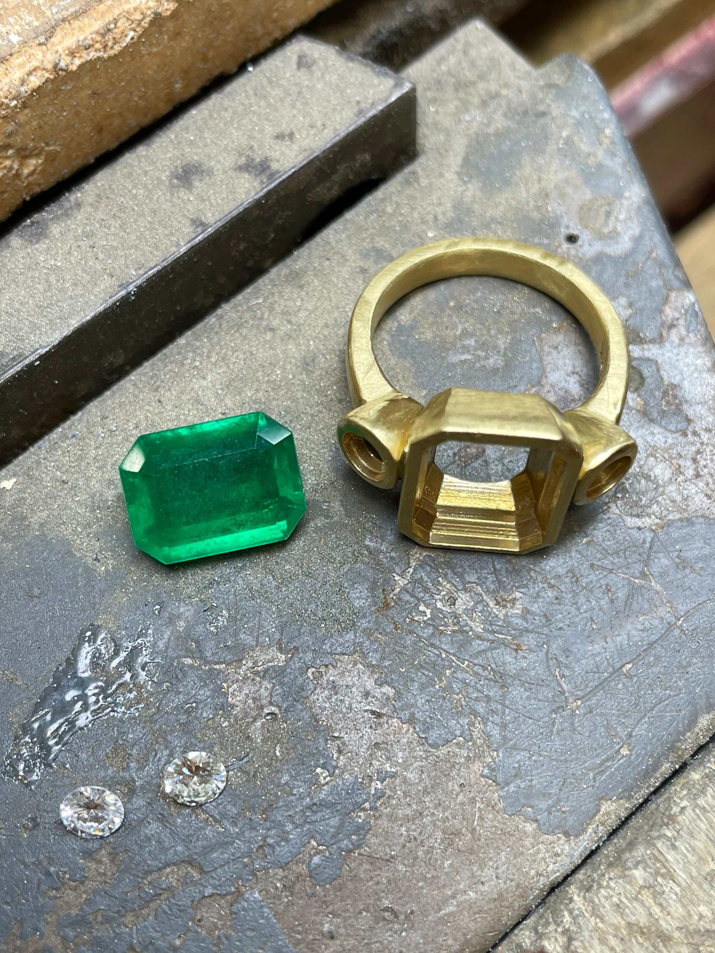 statement emerald and diamond bezel ring with heirloom design