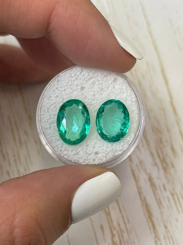 Oval Cut Colombian Emeralds - 7.31 Total Carat Weight - Pair of 12x9 Loose Stones