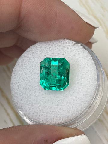 Emerald Cut 4.09 Carat Colombian Emerald with Natural Green Freckles