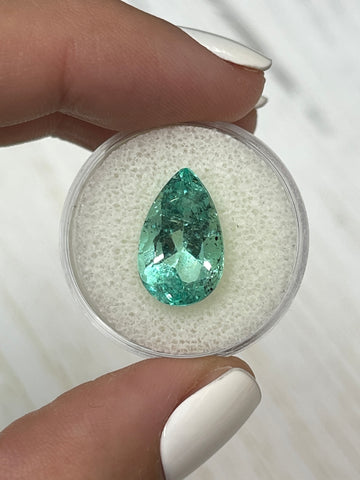 Large 6.41 Carat Pear-Cut Colombian Emerald with Light Green Color and Natural Freckles