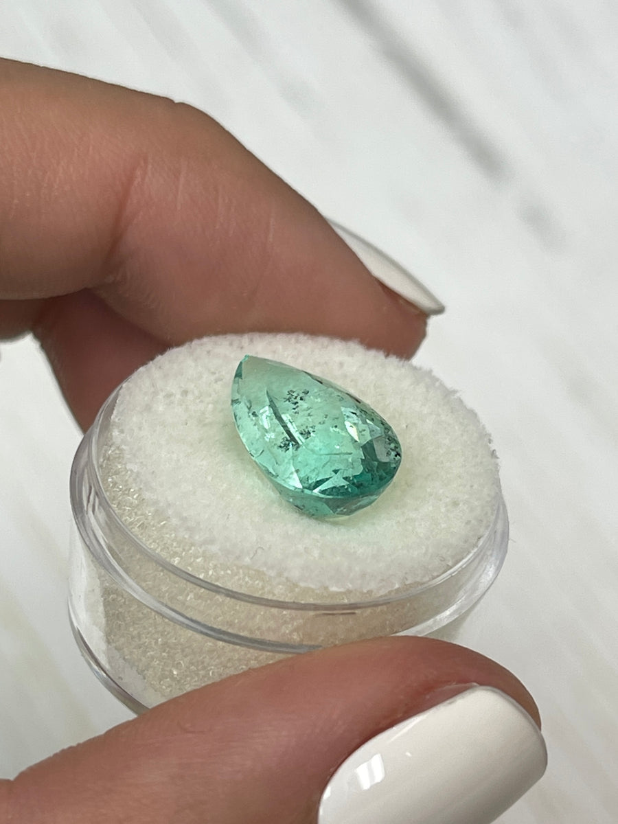 Pear-Cut 6.41 Carat Colombian Emerald in a Light Green Hue with Natural Freckles
