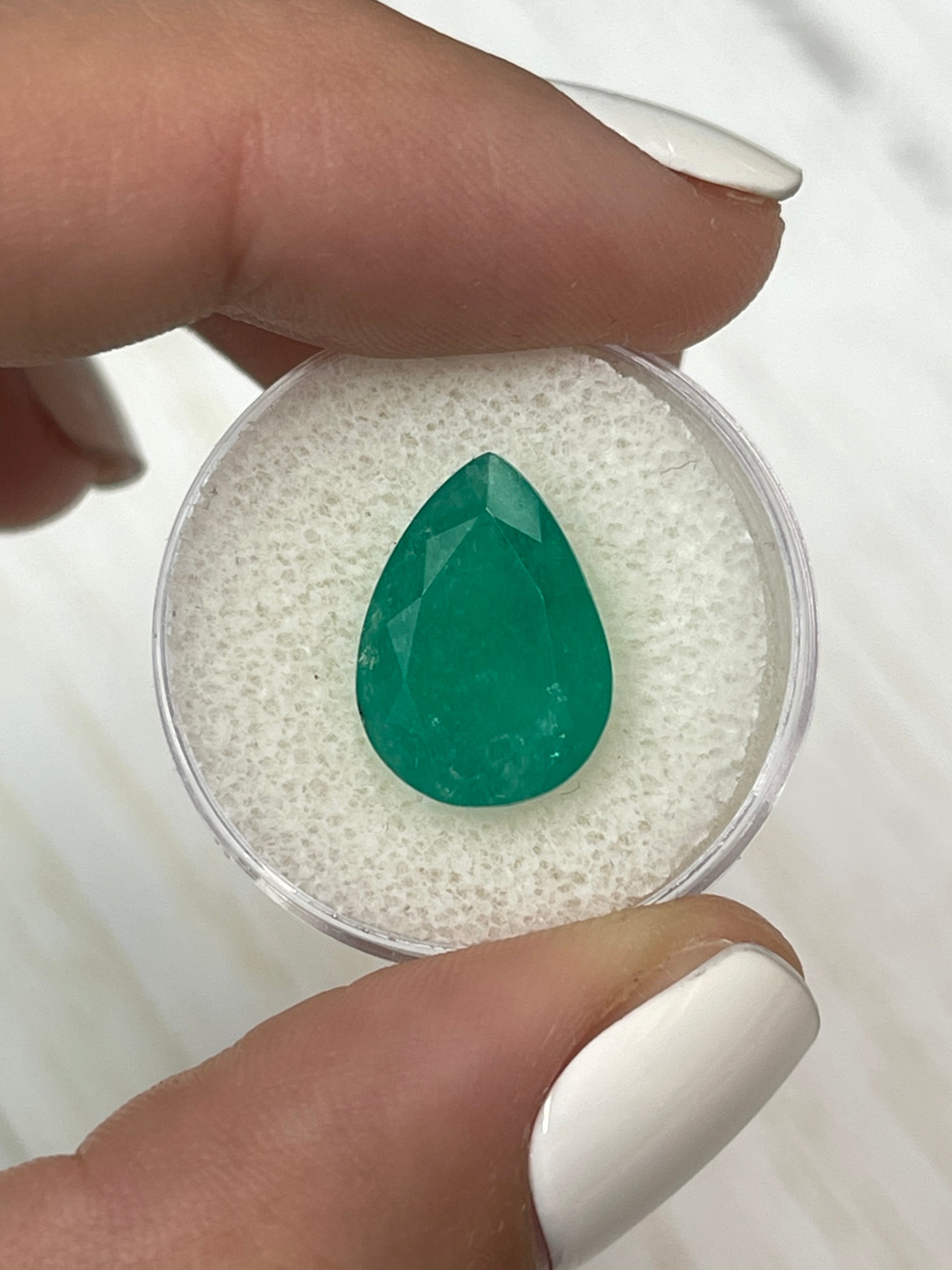 6.59 Carat Pear-Shaped Colombian Emerald in Its Natural Forest Setting