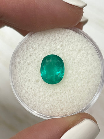 Oval Cut 60 Carat Loose Colombian Emerald with a Powerful Bluish Green Hue Measuring 9x7.3mm