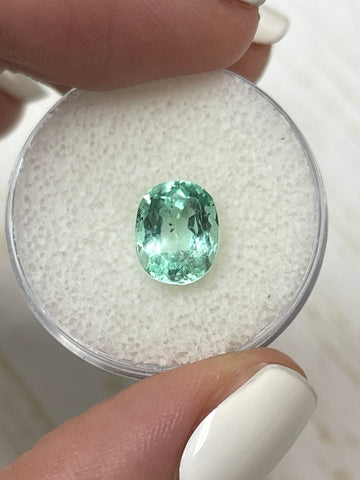 Oval-Cut 2.10 Carat Loose Colombian Emerald in Unique Freckled Sea Foam Green