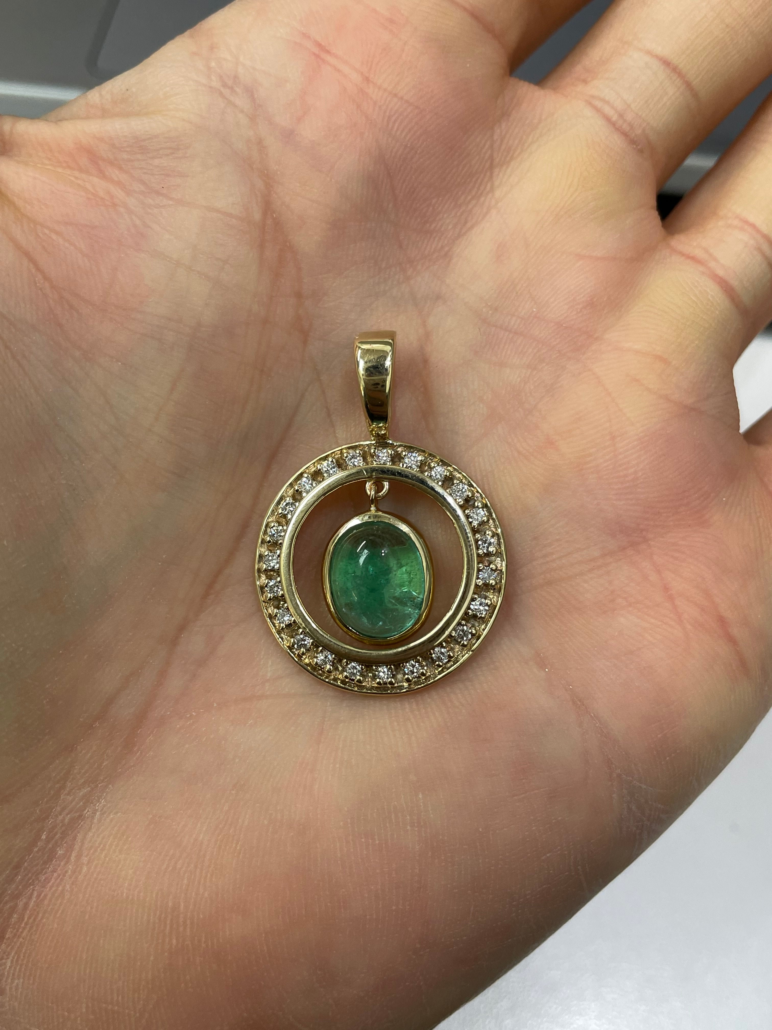 Cabochon Colombian emerald and diamond halo pendant in 14K