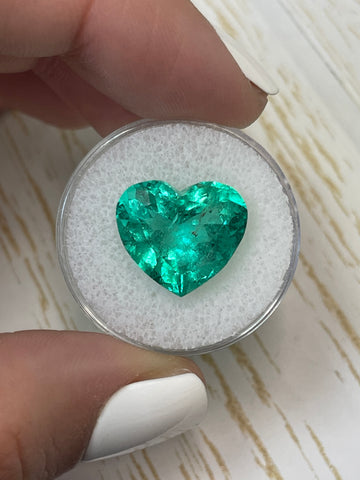 Stunning 8.90 Carat Heart-Cut Loose Colombian Emerald in a 14x15mm Size with a Bluish Green Hue