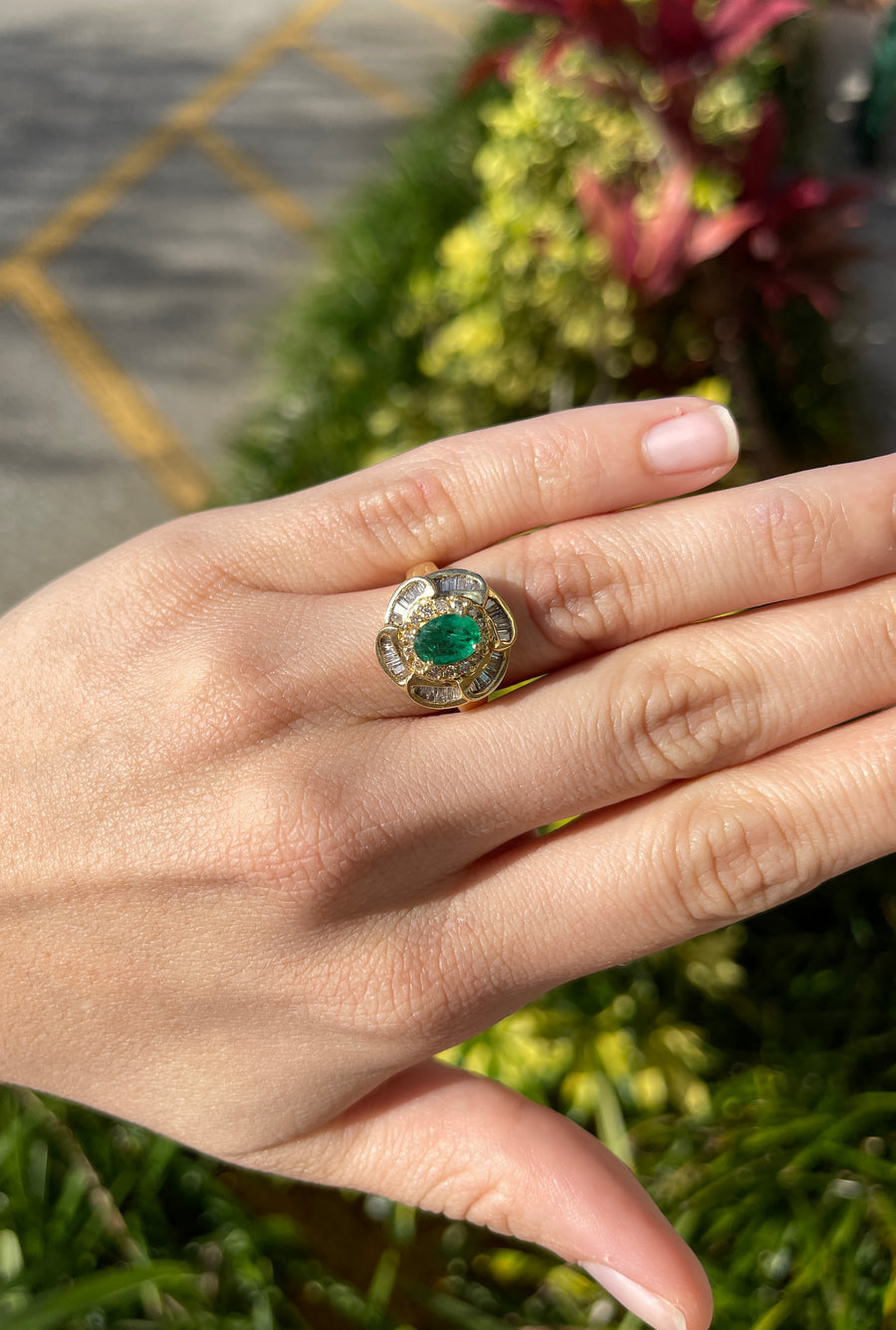 Oval emerald with pear shaped diamond side stones in 18ct yellow gold –  Daniel Greenberg