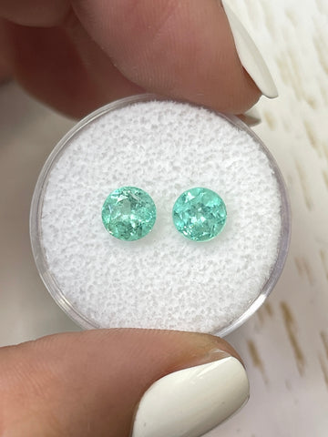A Pair of 1.85 Total Carat Weight 6x6 Round Colombian Emeralds in Delicate Green