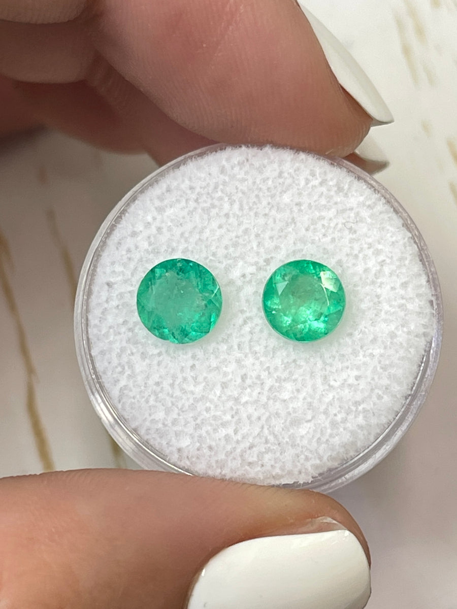 Pair of 2.06 Total Carat Weight Natural Colombian Emeralds in Matching Yellow-Green Hue - Round Cut Gemstones