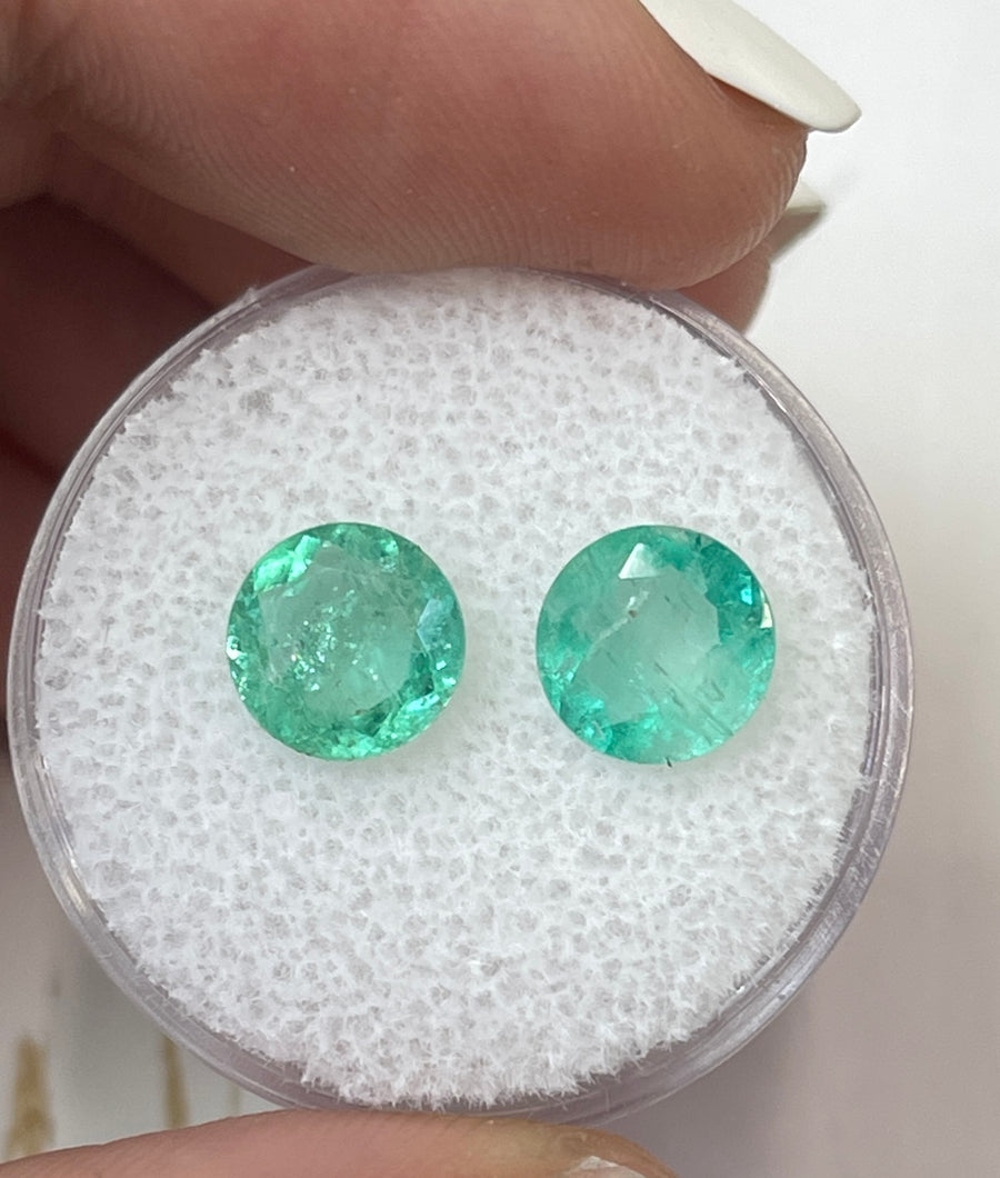 Pair of 2.44 Total Carat Weight Light Green Round Colombian Emeralds