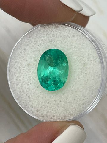Oval Cut 3.86 Carat Colombian Emerald in Stunning Spring Green Hue