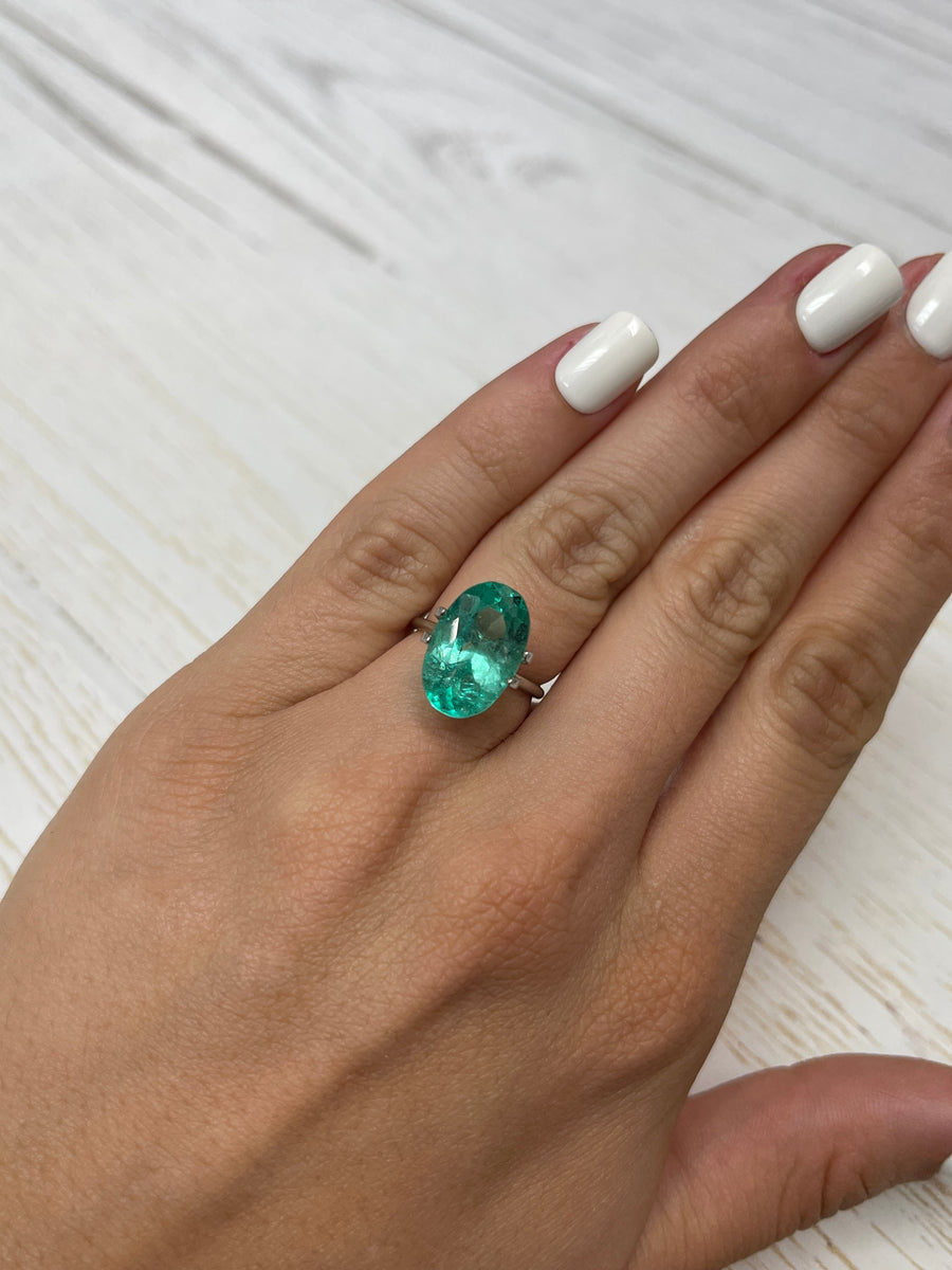 Exquisite 7.55 Carat Bluish Green Oval Emerald