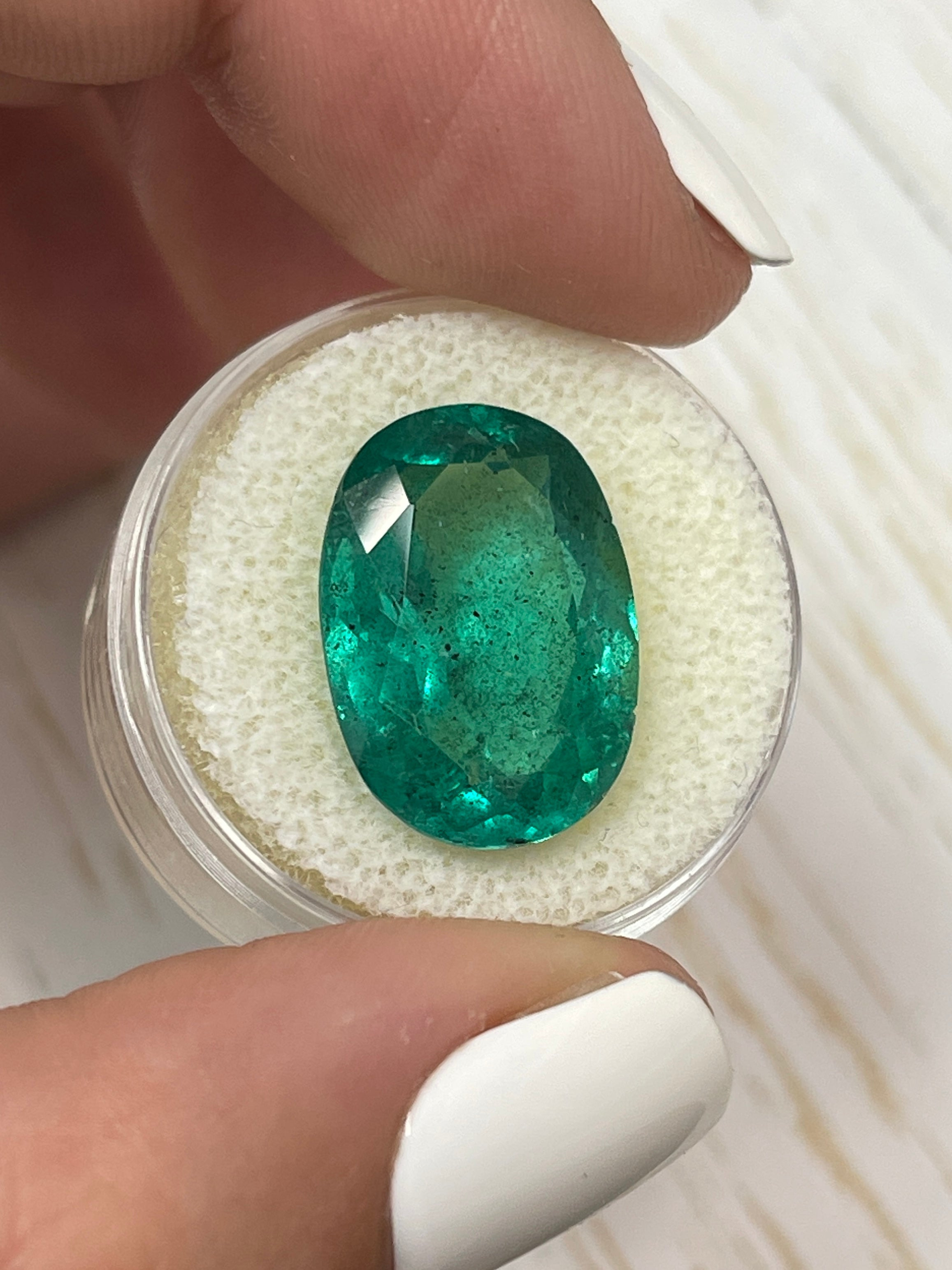 Vibrant 12.42 Carat Colombian Emerald - Oval Cut Loose Gem in Earthy Green