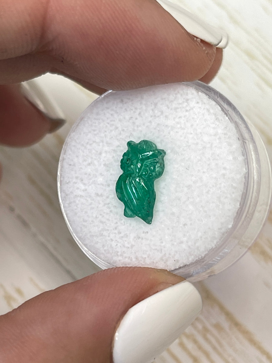 Artisan-Carved Owl in Emerald, Measuring 11mm x 6mm and Weighing 1.79 Carats