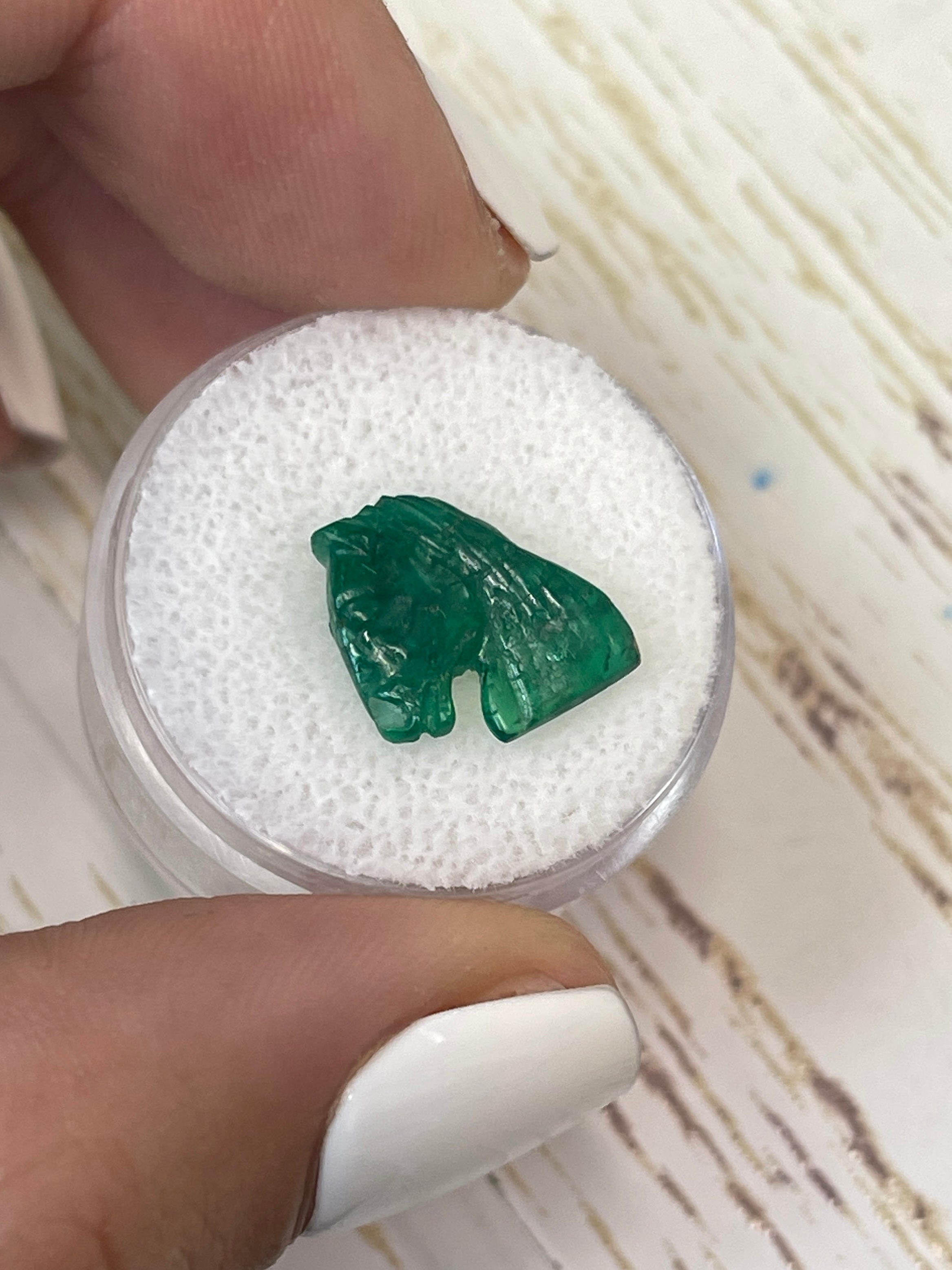 ALT Text for 12mm x 11mm Hand-Carved Emerald Equine Artwork