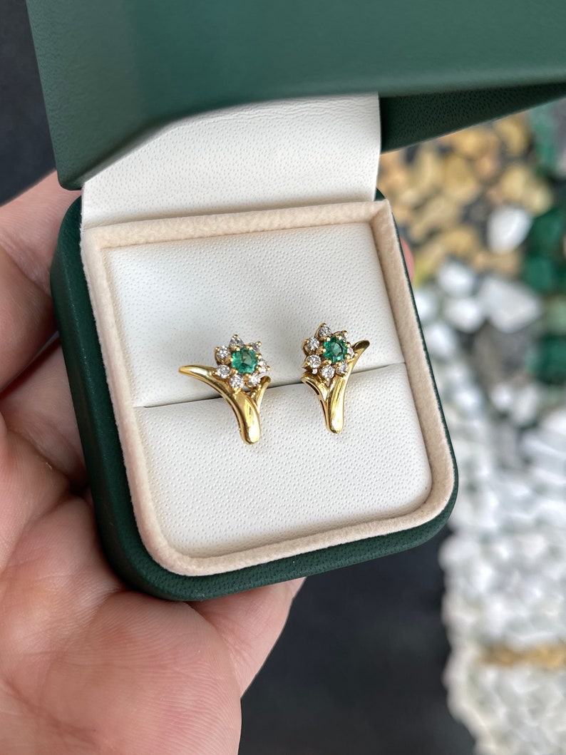 Natural spring green emerald and diamond floral halo earrings from Colombian Emerald, 18K gold, showcasing intricate design and sparkle.