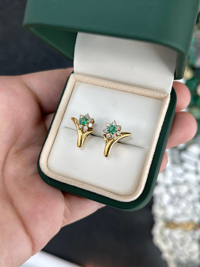 Natural spring green emerald and diamond floral halo earrings in 18K gold by Colombian Emerald, showcasing intricate design and sparkle.