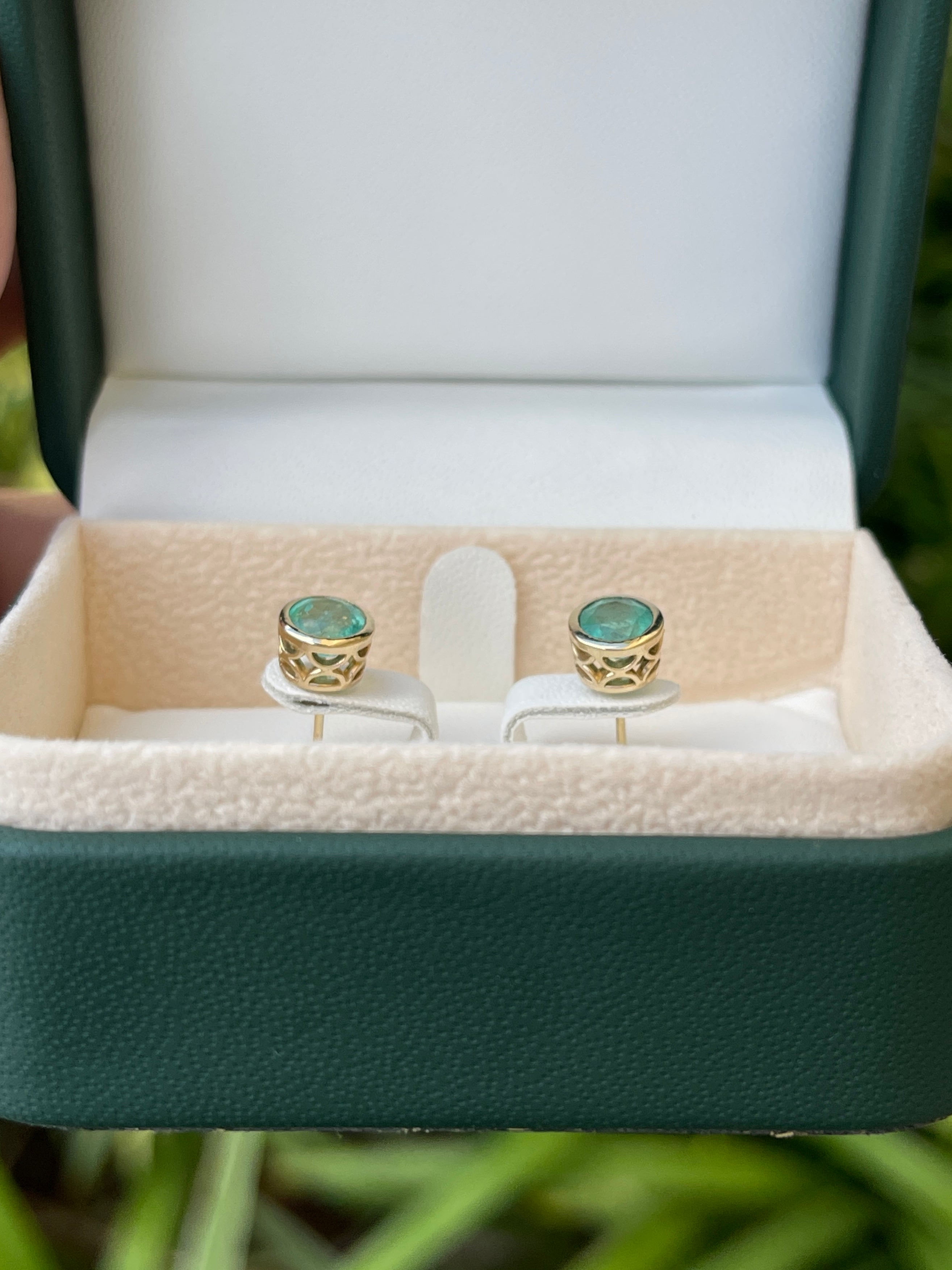 Round cut natural emerald earrings with 1.60 tcw, 14K gold, and push back clasps from Colombian Emerald brand.