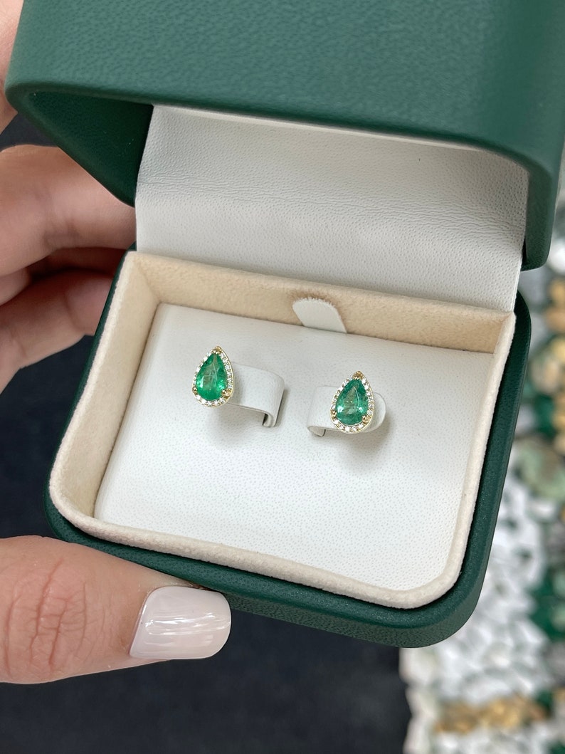 14K yellow gold teardrop pearl and emerald earrings with diamond pave halo, featuring 1.87 tcw Colombian Emeralds and elegant design.