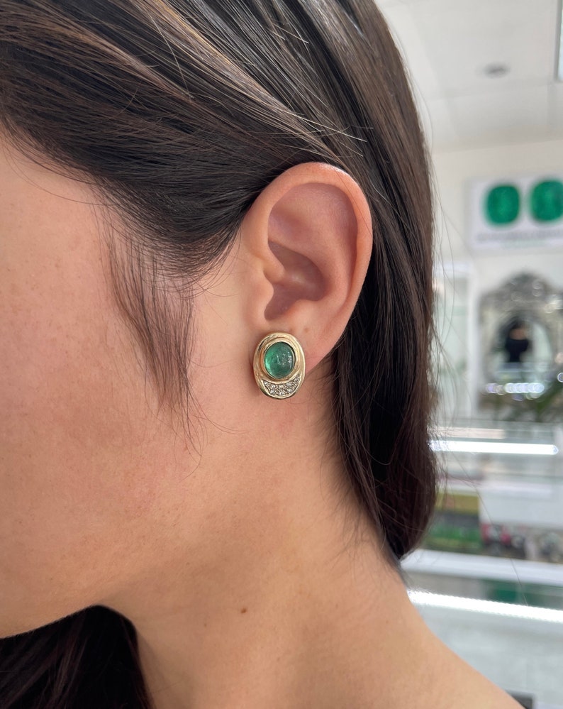 14K yellow gold emerald cabochon and diamond accent clip-on earrings by Colombian Emerald, showcasing elegant jewelry design