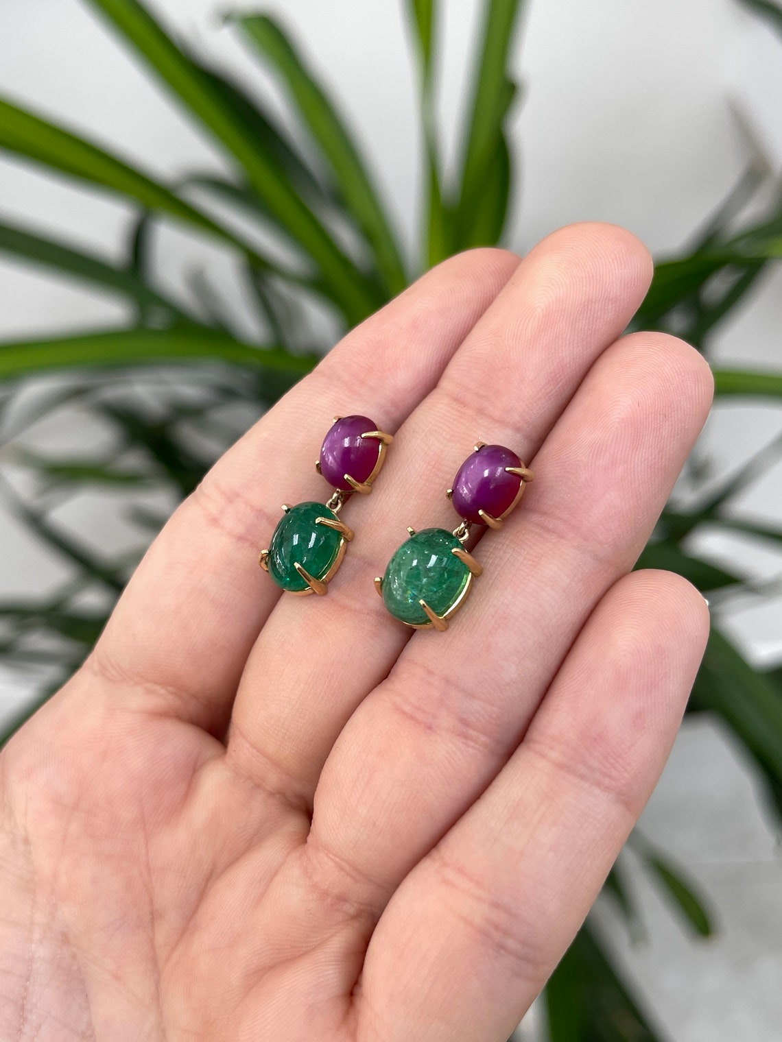 Colombian Emerald earrings with 13.82tcw natural emerald cabochon and 6-ray star ruby dangles in 18K gold.