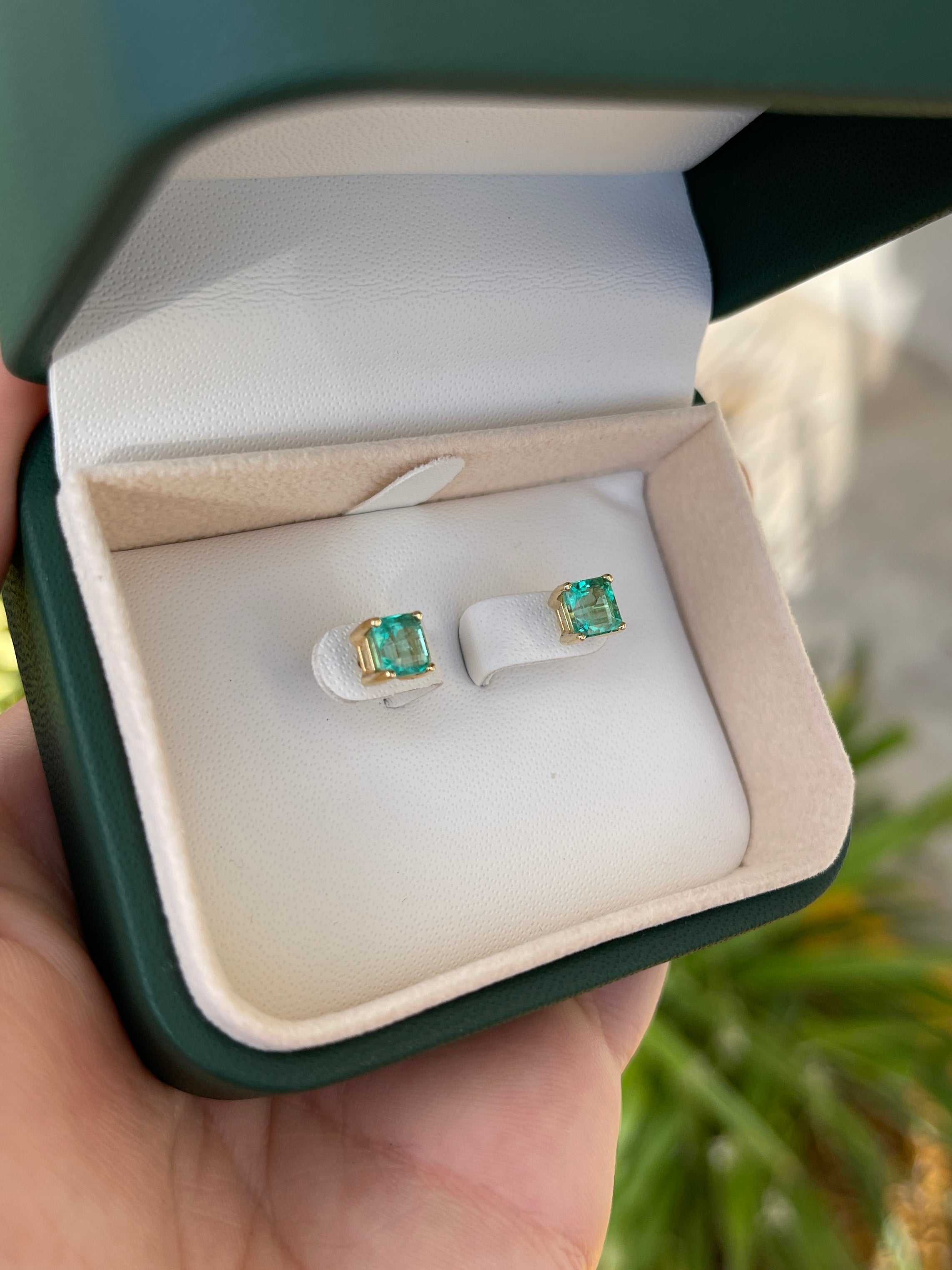 Pair of Colombian Emerald Asscher cut screw back stud earrings, 2.05 carats total weight, set in 14K gold.