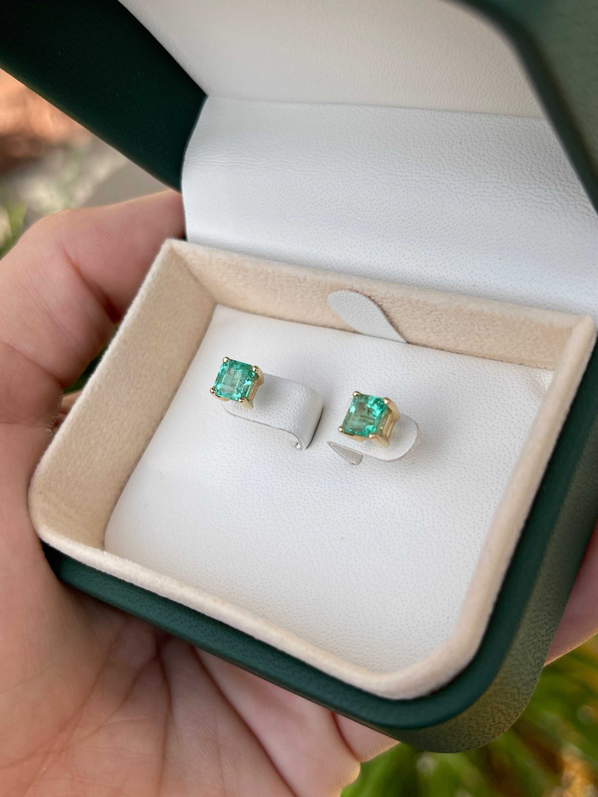 Colombian Emerald 2.05tcw Asscher cut screw-back stud earrings in 14K gold, featuring vibrant emerald gemstones.