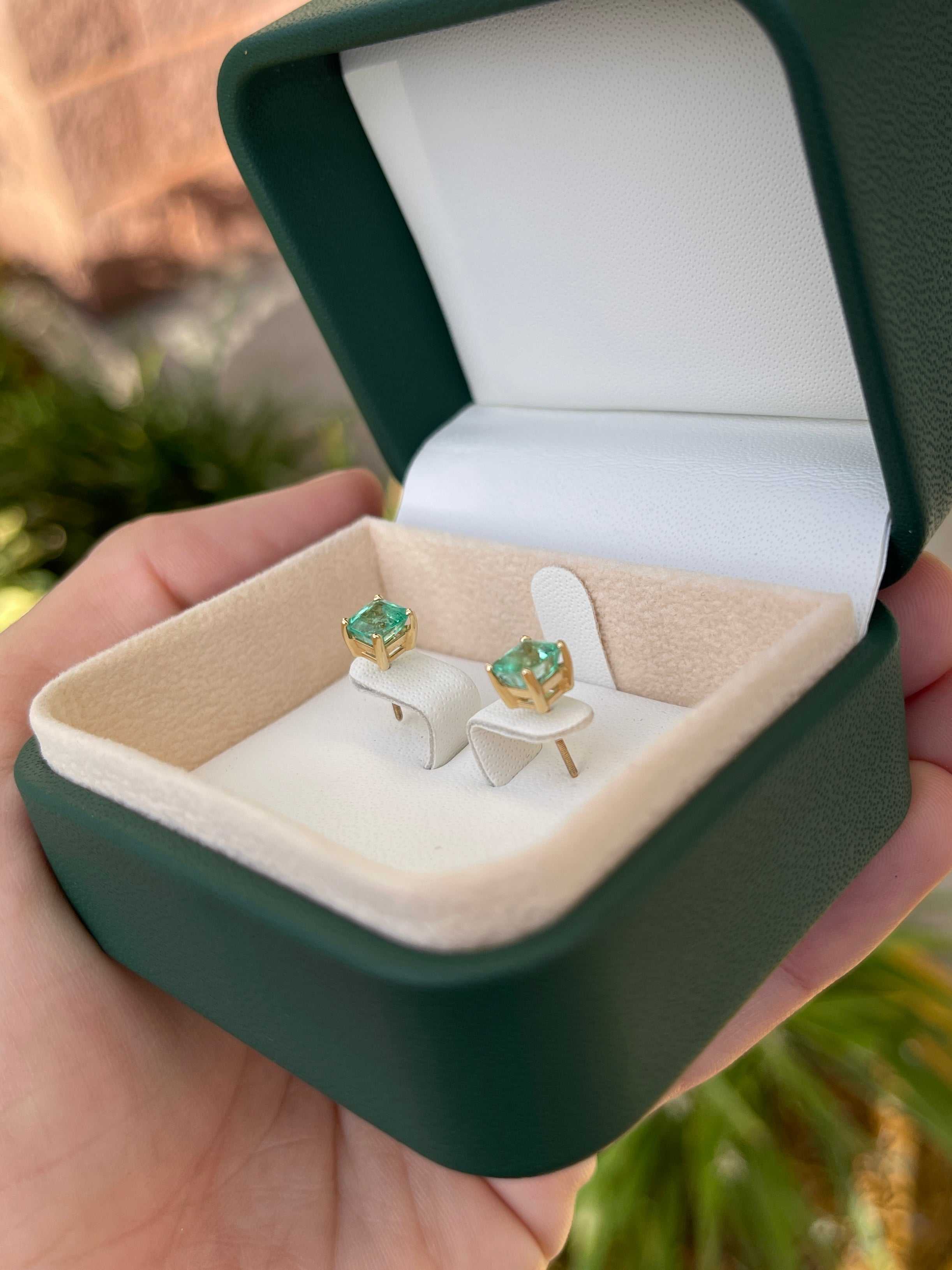 Colombian Emerald 2.05tcw Asscher cut screw back stud earrings in 14K gold, featuring vibrant green emeralds and elegant design