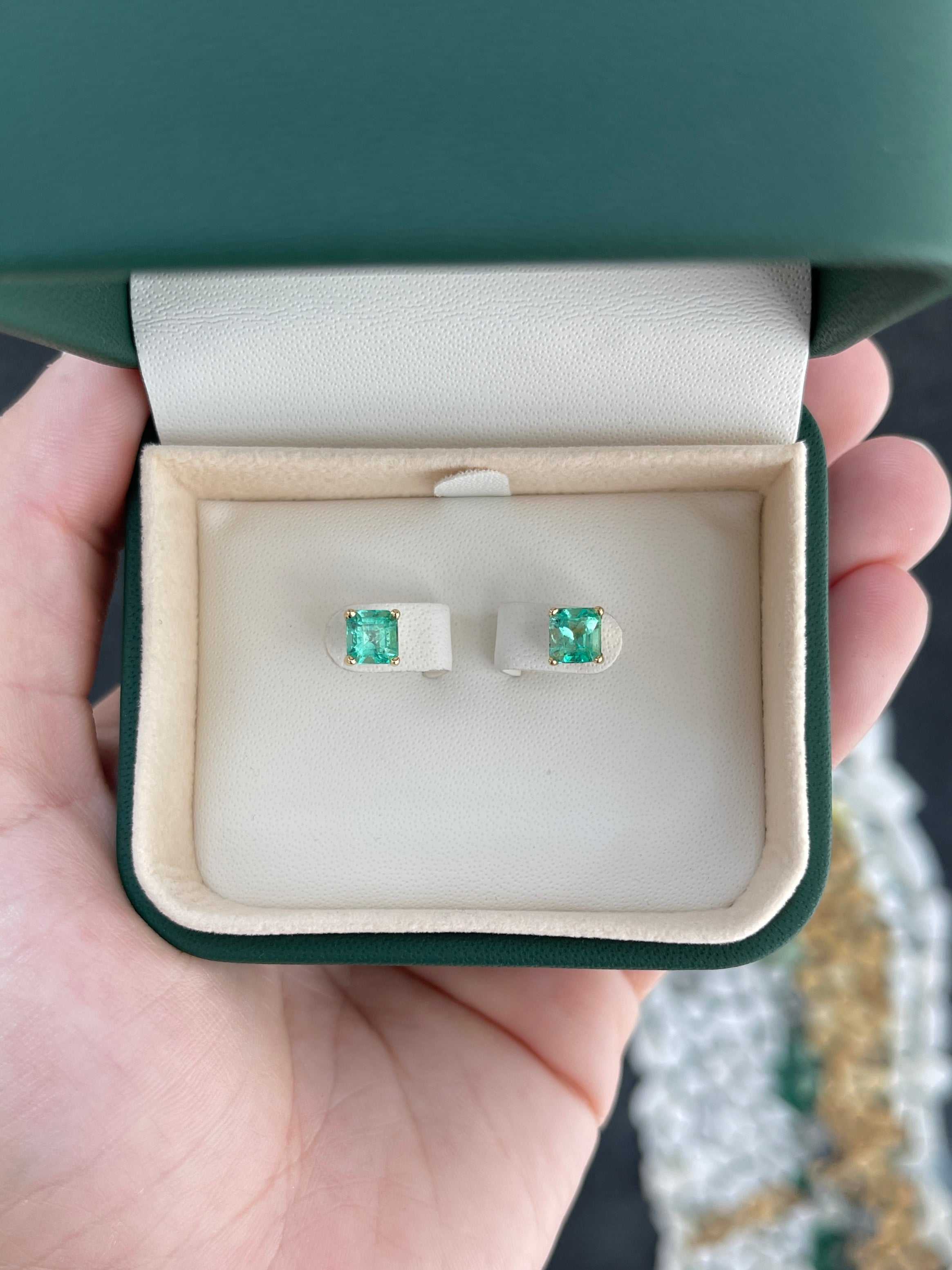 Colombian Emerald 2.05tcw Asscher cut screw back stud earrings in 14K gold, featuring vibrant emerald gemstones.