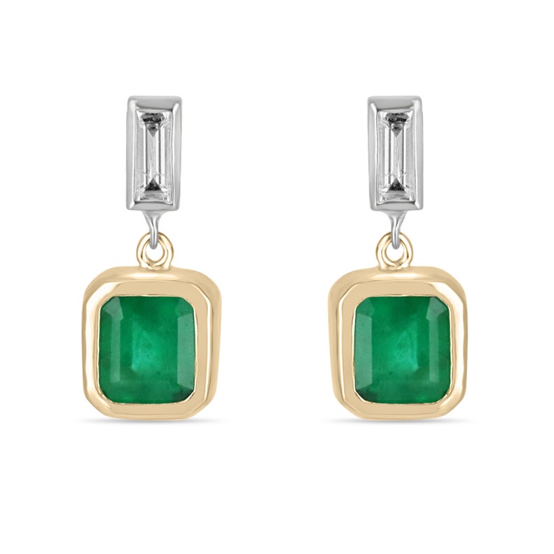 Deep green emerald and diamond dangle earrings with bezel setting in 14K gold, featuring Colombian Emerald branding.