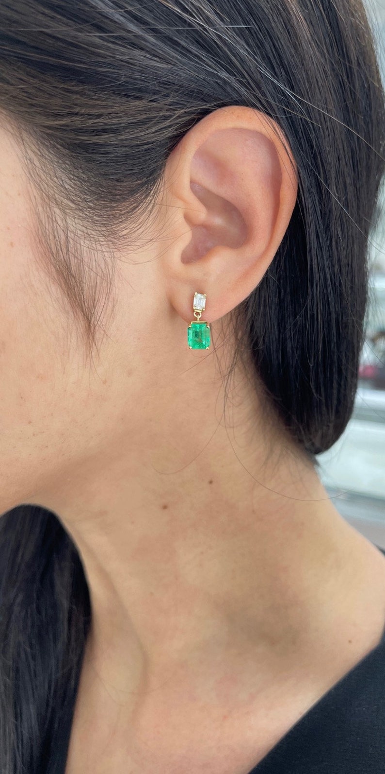 Elongated emerald and diamond dangle earrings in 18K gold with natural transparency, designed by Colombian Emerald.