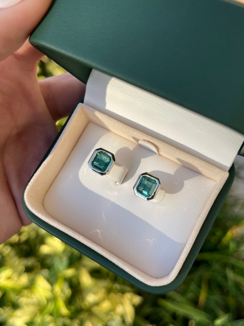 Dark vivid green emerald bezel stud earrings in 14K yellow gold with a total weight of 4.20 carats, by Colombian Emerald.