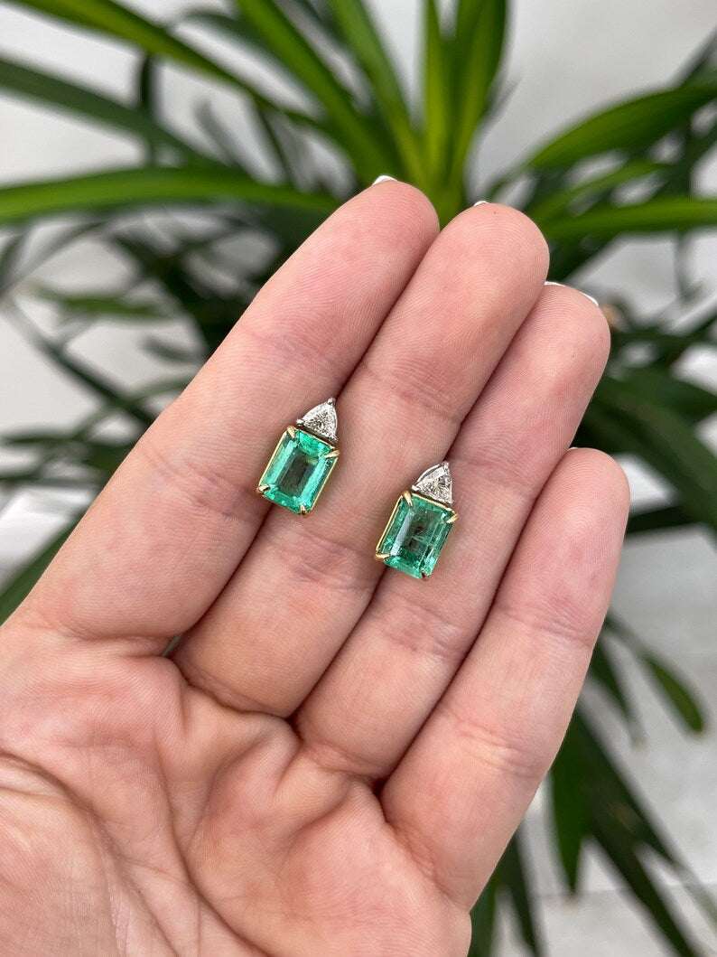 Colombian Emerald brand 18K gold platinum earrings with emerald cut Colombian emeralds and diamond trillion accents, two-stone design