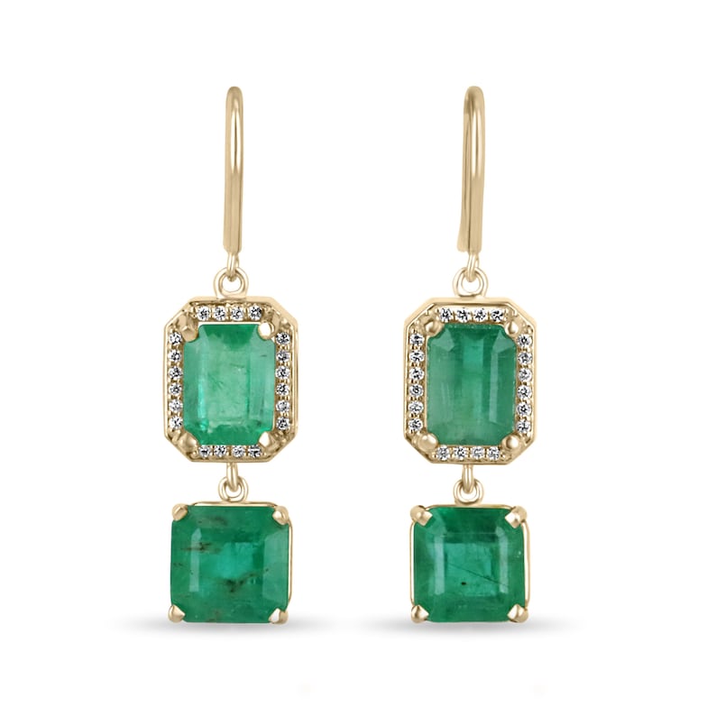 14K gold emerald and diamond halo dangle earrings featuring 7.39tcw natural Colombian emeralds and sparkling diamonds.