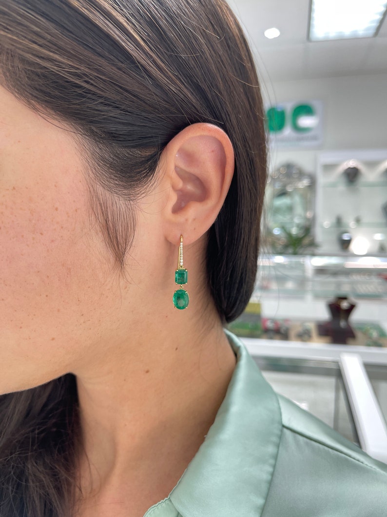 Dark green emerald and diamond accents dangle earrings in 18K gold, featuring fine quality Colombian emeralds and elegant design
