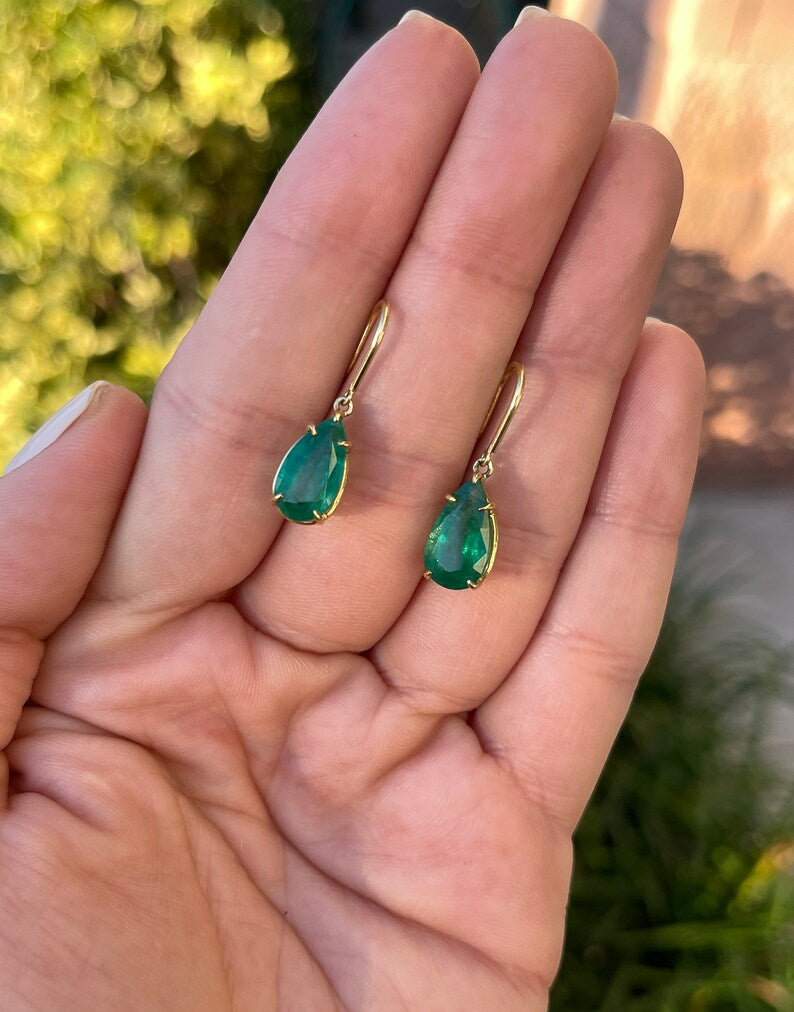 Colombian Emerald earrings with 5.0tcw dark green teardrop emeralds on gold hooks, showcasing elegant dangle jewelry.