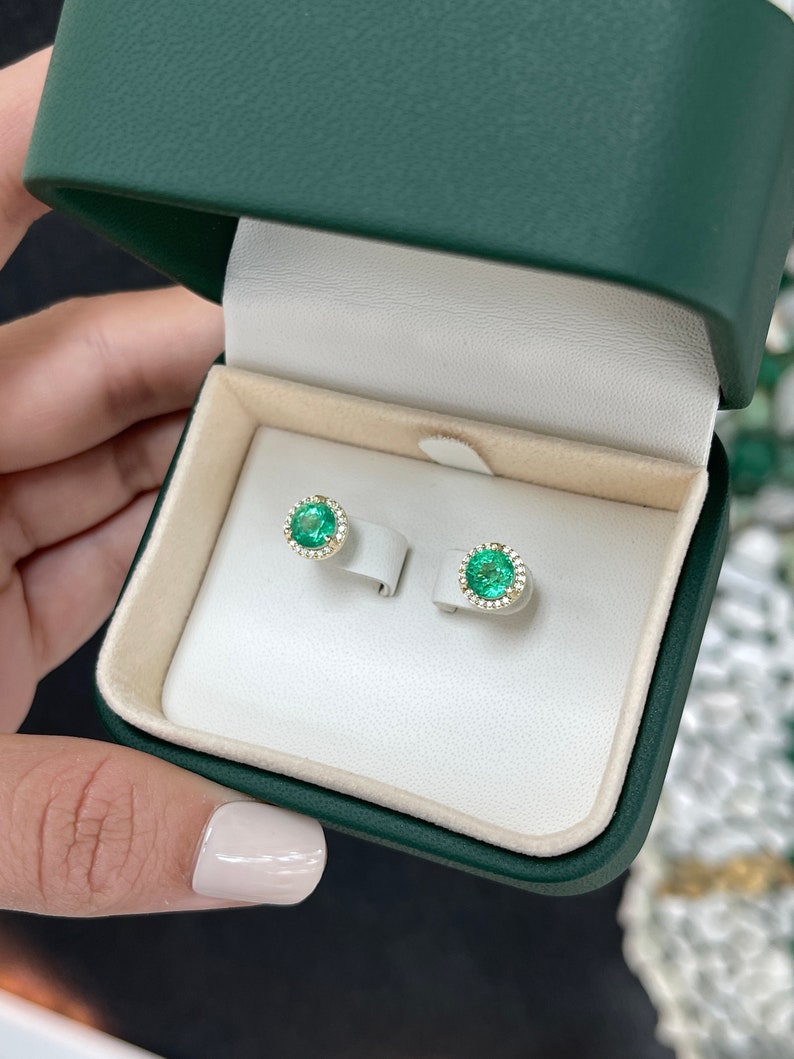 14K gold emerald and diamond halo stud earrings with 8.5mm round gemstones, Colombian Emerald brand, elegant jewelry.