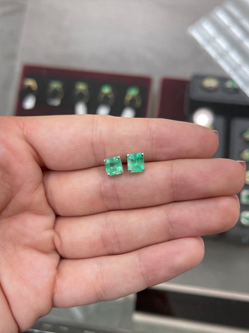 Blue green Colombian Emerald Asscher earrings with 3.58tcw in 14K gold, showcasing the vibrant gemstones and elegant design.