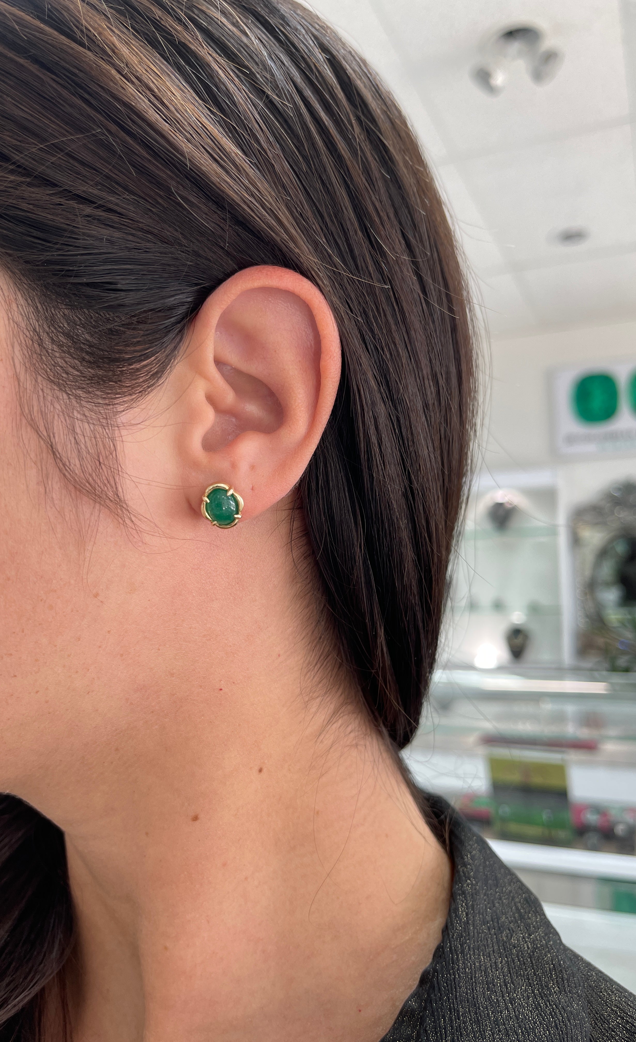 Colombian Emerald 14K gold oval-shaped stud earrings featuring 3.85 carats of dark green natural emerald cabochons, May birthstone jewelry