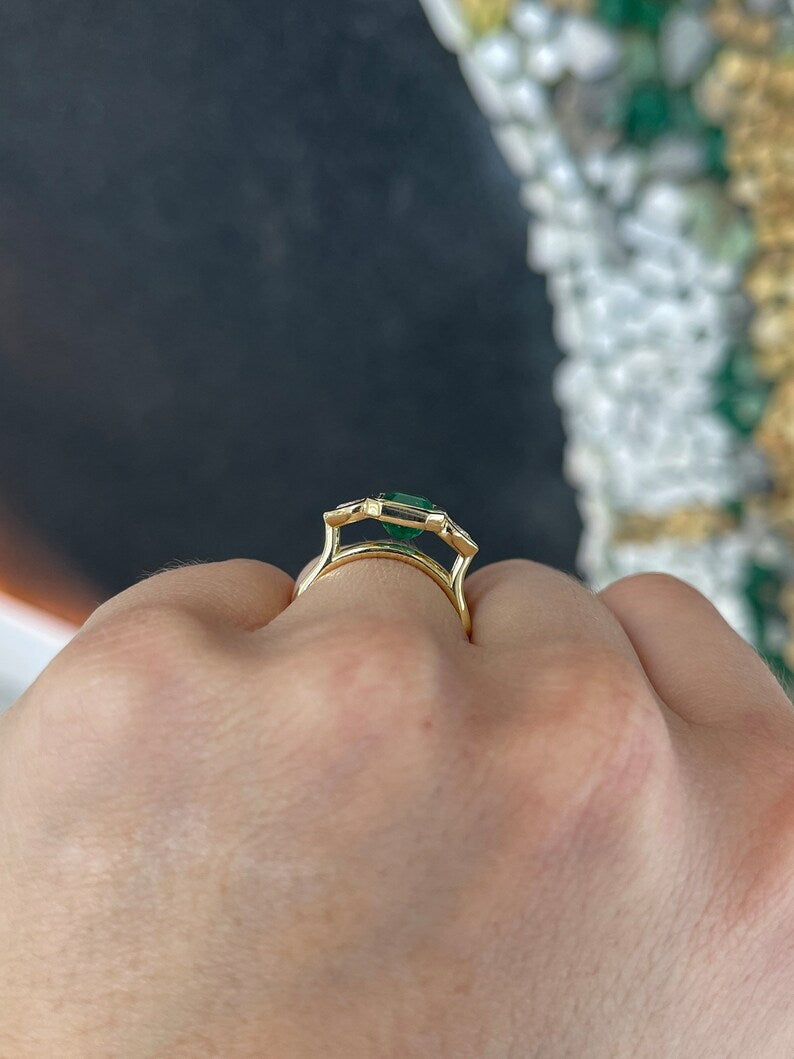 Colombian Emerald 18K yellow gold engagement ring with 2.97tcw emerald and heart-cut diamonds, three-stone design, dark alpine gold.